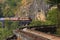 Thai trains running on death railways crossing kwai river in kan