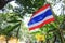 Thai Tricolor Thailand Nation`s Flag 5 horizontal stripes in colors red, white and blue at center and Thai Buddhist Yellow Flag