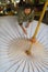 Thai woman assembles traditional bamboo umbrella at the factory in Chiang Mai, Thailand.