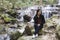 Thai woman with Mae Kam Pong waterfall, Chiangmai Thailand