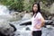 Thai woman with Mae Ya waterfall, Chiangmai Thailand