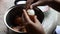 Thai woman peeling boiled egg