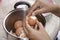 Thai woman peeling boiled egg for cooking