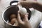 Thai woman peeling boiled egg for cooking