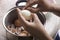 Thai woman peeling boiled egg for cooking