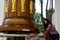 Thai woman people praying and rite rotate and spin big bell