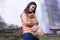 Thai woman with pomeranian at Wachirathan waterfall chiangmai