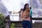 Thai woman with pomeranian at Wachirathan waterfall chiangmai