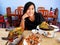 Thai woman posing with thai food set and hold for show Spicy Horseshoe Crab Egg Salad