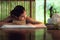 Thai Woman is Therapies Body With Spa Massage and Lying Relaxation in Business Massaging and Salon Shop., Pretty Attractive Asian