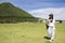 Thai woman travel and posing for take photo on grass field Chang Hua Man Royal Initiative and Agricultural Project