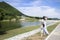 Thai woman travel and posing for take photo on grass field Chang Hua Man Royal Initiative and Agricultural Project