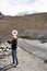 Thai woman travel visit and take photo on Pangong lake road with himalayan mountains at Leh Ladakh in Jammu and Kashmir, India