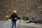 Thai woman travel visit and take photo on Pangong lake road with himalayan mountains at Leh Ladakh in Jammu and Kashmir, India