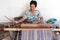 Thai woman weaving straw mat