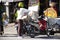 Thai women food drinks delivery sending products to customers Tha Na local and old market at Nakhon Chai Si city on November 26,