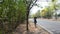 Thai women running beside road