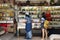 Thai women select and buy holy amulet and jade accessory form talismans souvenir shop of Kaiyuan Temple at Teochew in Guangdong