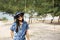 Thai women standing relax and playing swings toy for take photo at Saeng Chan Beach in Rayong, Thailand