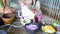 Thai women washing and clean clothes after tie batik dyeing