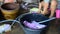 Thai women washing and clean clothes after tie batik dyeing