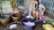 Thai women washing and clean clothes after tie batik dyeing