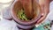 Thai womens preparing green papaya salad som tam in wooden mortar with pestle. Close Up. 4k