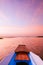 Thai wooden boat bow travel in peaceful Nong Harn lake - Udonthani, Thailand. Famous red lotus lake in winter