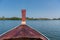 Thai wooden head longtail boat heads toward