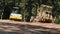 Thai workers use heavy machinery made and build road at Doi Tung in Chiang Rai, Thailand