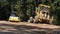 Thai workers use heavy machinery made and build road at Doi Tung in Chiang Rai, Thailand