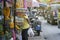 Thai wreath on a pipe at thai local or traditional market,side of street,with customer of a thai wreath shop,selective focus