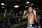 Thai young boxer stand in front of boxing ring