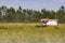 Thailand Combine harvesters working rice field