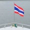 Thailand flag in front of big boat