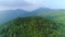 Thailand jungle aerial: mountains tops and sides with green deciduous forests. Mesmerizing landscape