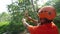 Thailand, Koh Samui, 26 january 2016. Canyoning instructor explains how to slide a rope descent in tropical jungle.