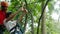 Thailand, Koh Samui, 26 january 2016. Canyoning instructor explains the tourist man how to hold onto a slingshot on a