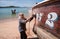 Thailand Local Fisherman fix and repair wooden longtail fishing boat at Chalong bay. Phuket