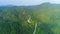 Thailand mountains road aerial: rainforest with misty foliage on leafy trees of Koh Phangan island