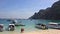 Thailand, Phi Phi Islands, Speedboats at Anchor and Unidentified Tourists.