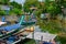 Thailand. Phuket - 01/05/18. Traditional wooden longboats of fishermen staying on anchor in canal