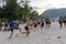 Thailand, Phuket, March 30, 2020: men and teenage girls from China play soccer and Rugby with a ball on the beach. a sharp