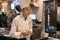 Thailand, Phuket, Patong. January 3, 2020: A young chef smiles as he accepts a customer order at a Japanese Tepanyaki