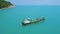 Thailand\'s turquoise oceans aerial ship shot at majestic seascape. Water surface blend to blue sky