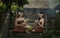 Thailand women in traditional dress sitting for made of flower garlands.