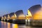 Thames Barrier And Canary Wharf, London UK