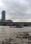 On the Thames beach this autumn view west across the River Thames with Blackfriars Bridge and station, seagulls and small waves