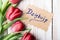 Thank you card (Polish word dziÄ™kujÄ™) and tulip bouquet