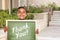 Thank You Chalk Board Held by Hispanic Boy on School Campus